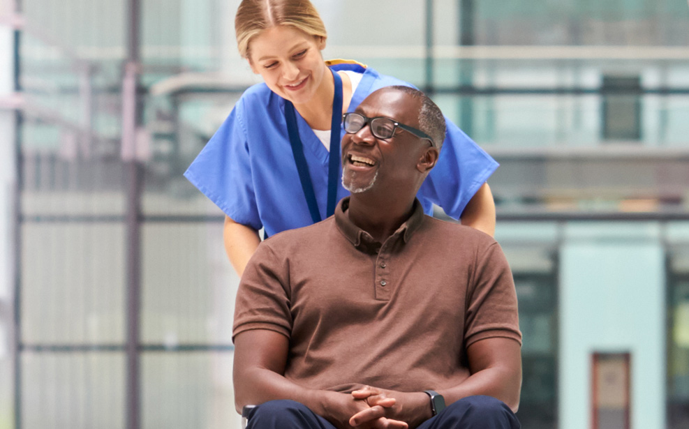 Nurse with man in wheelchair